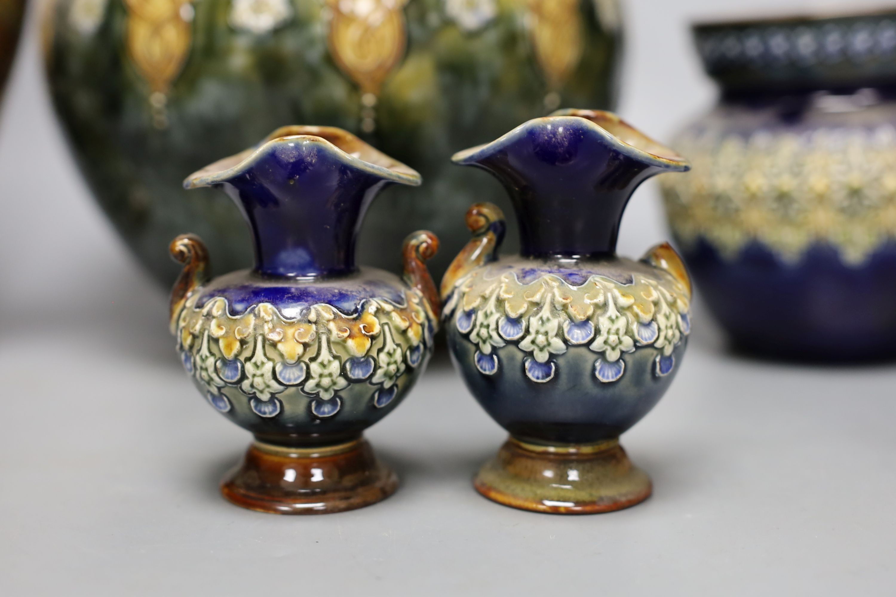 10 pieces of Doulton Lambeth stoneware including a jardiniere, vases etc, largest item jardiniere, 19 cms diameter.